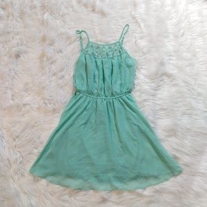 SEQUIN HEARTS teal dress with cross detail front